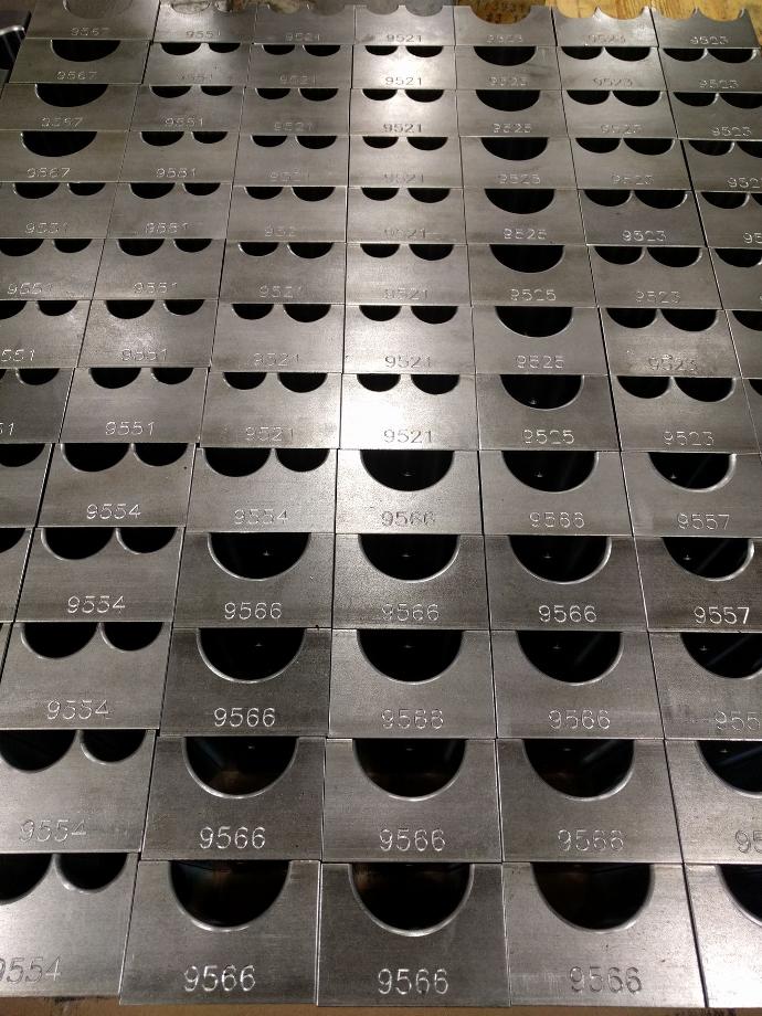 Engraved steel bending dies for pipe and tubing. 