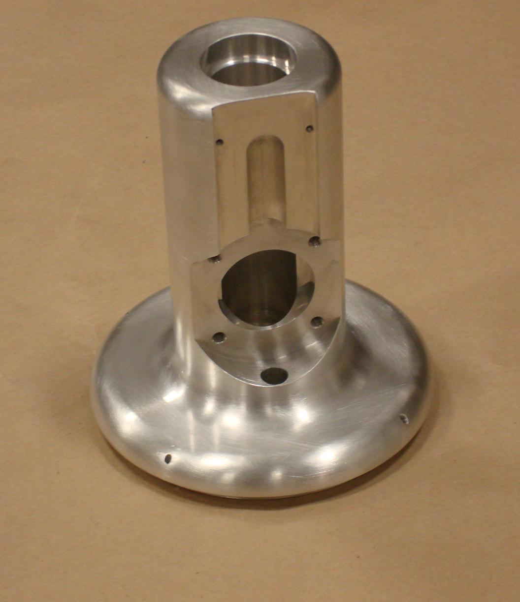 Turned and machined aluminum component with tight tolerance and finish requirements.