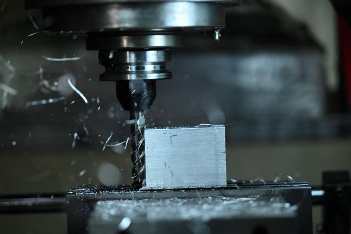 Machining center milling aluminum part.