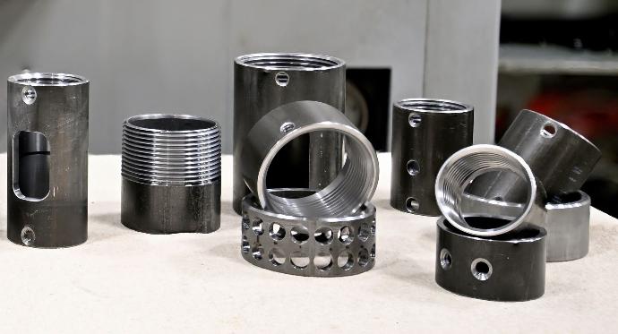 Steel pipe and DOM with machined features including: threading, drilling, tapping, and milling.