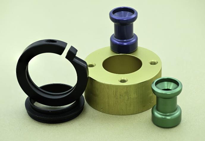 Custome machined black, gold, blue, and green anodized aluminum parts.